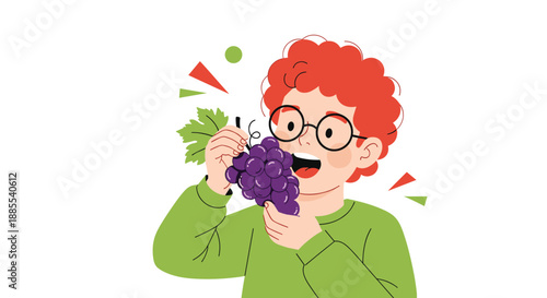 A happy young boy with red hair and glasses is smiling while eating a large bunch of fresh purple grapes for a snack.