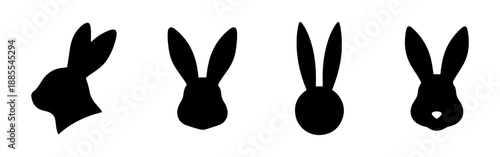 Set of four black rabbit head silhouettes. Vector illustration of bunny faces with long ears for Easter design.