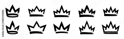 Collection of ten hand-drawn black crown silhouettes. Set of rough brush style vector illustrations of royal symbols.