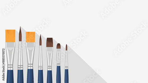 Collection of artist paint brushes with blue handles and varying tips