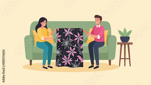 Couple admires a batik fabric on a sofa with a plant nearby