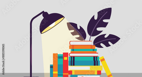 Cozy reading nook with stack of colorful books illuminated by a desk lamp and a tropical plant.