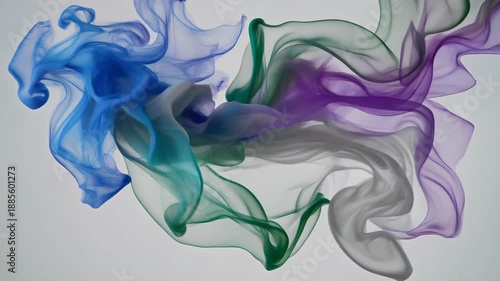 Flowing, translucent fabrics in blue, green, and purple, gracefully cascade against a neutral gray backdrop, creating an ethereal ambiance