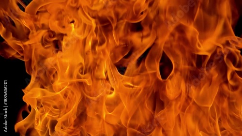 Beautiful bright fiery flame in slow motion. Colorful growing bonfire.