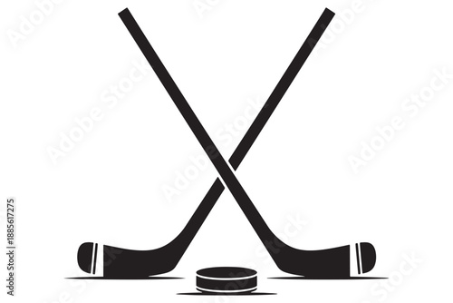 A pair of hockey sticks crossed over a puck on a white background