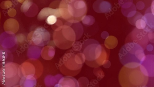 Vibrant Bokeh: A captivating display of soft, out-of-focus circles dance across a rich burgundy backdrop, creating an abstract tapestry of color and light.