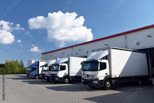 Trucks loading at a depot of a forwarding agency - Transport and logistics in goods trade