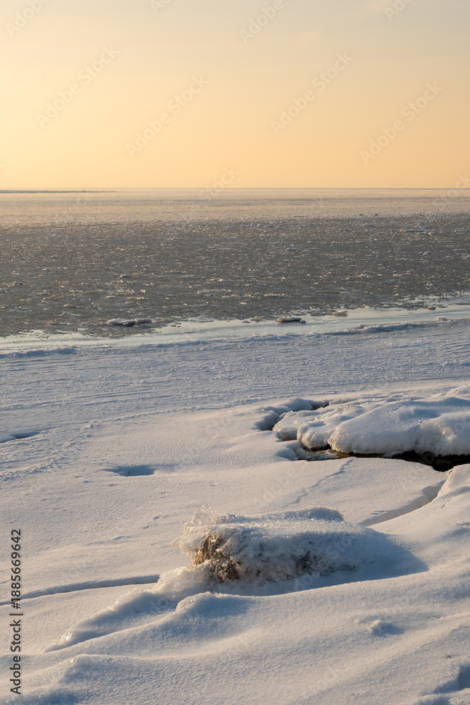 Fototapeta premium Winter coastline of Hel Peninsula with frozen Baltic Sea. Kuznica village in Poland, Europe