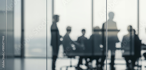 Crisp office framed by floor to ceiling windows show a professional meeting in progress, capturing teamwork, innovation, and strategic thinking in a modern corporate setting.