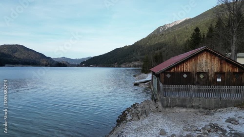 Wooden boat house on the Achensee mountain lake in the Austrian Tyrolean Alps in the Karwendel Mountains winter landscape