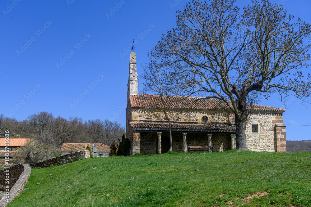 Fototapeta premium Stone Church of San Miguel in Verde?a with bell gable