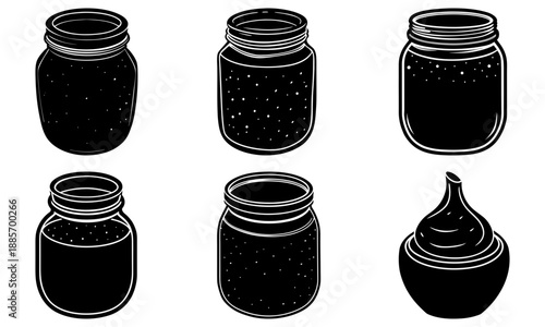 Six black jars and a container of creamy substance on white