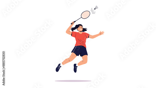 Athletic young woman jumping high in the air to hit a shuttlecock with her racket while playing an energetic game of badminton.