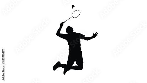 A black silhouette of a man jumping to hit a shuttlecock with a badminton racket on white background