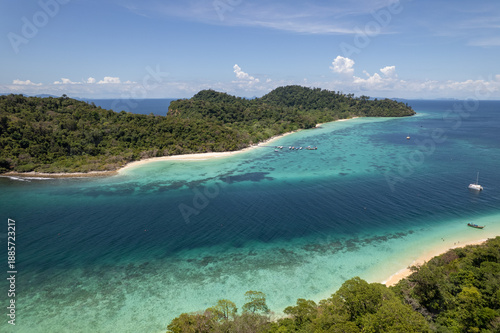 Tropical paradise white sand beach with palm trees on Koh Rok, Mu Ko Lanta National Park.