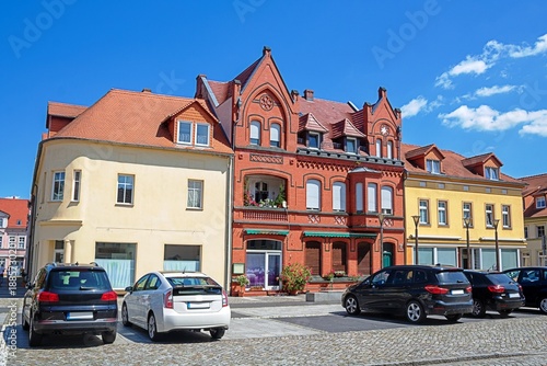 vetschau, deutschland - sanierte häuserzeile am marktplatz
