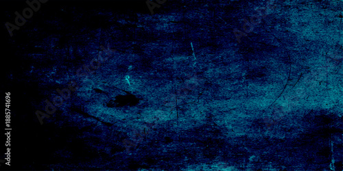 Abstract dark blue grunge background featuring a textured smoke pattern and light effects with artistic space for text on a moody storm cloud backdrop