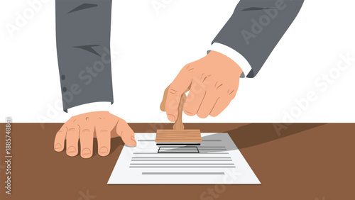 A person's hand firmly applying a rubber stamp to a formal document, signifying approval or official verification on a desk.