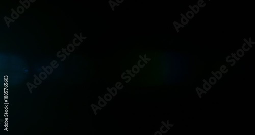 Slow motion cinematic lens flare and light leak effect isolated on black background. Perfect overlay for VFX, transitions, title reveals, film burn style and glow highlights.
