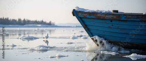 Fishing boat navigating through icy water in winter landscape  