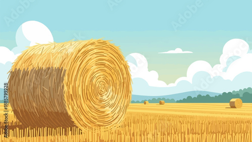Large hay bale in a golden field under a cloudy sky