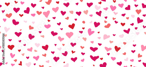 Pink hand-drawn hearts forming a seamless pattern on a white background. Pink heart pattern creating simple love background