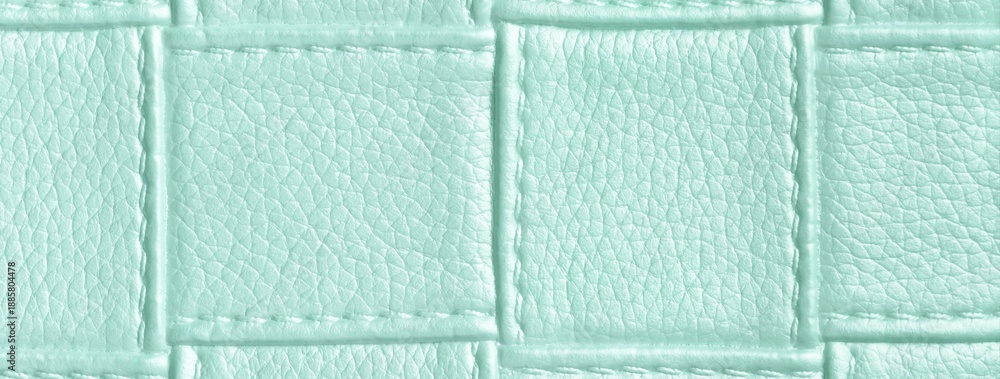 Fototapeta premium Texture light mint leather background with quilted stitched pattern, macro. Abstract pastel upholstery surface