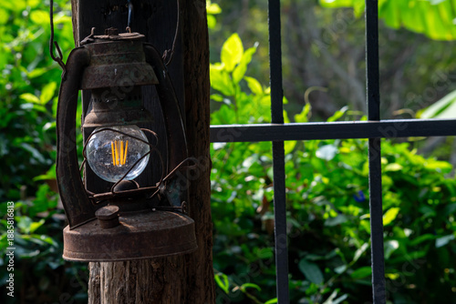 Classic Oil Lantern with Natural Garden Background