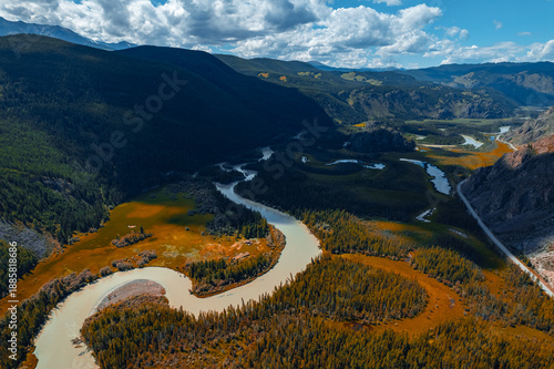 Foto Beautiful aerial landscape winding river meander in mountains with forest trees