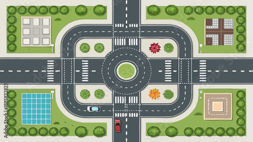 Modern city intersection with roundabout and green spaces