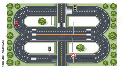 Modern city road intersection with traffic lights and greenery