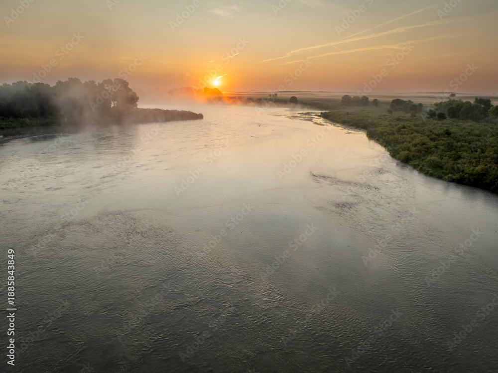 Fototapeta premium foggy sunrise over the Dismal River in Nebraska Sandhills at Nebraska National Forest, late summer morning scenery