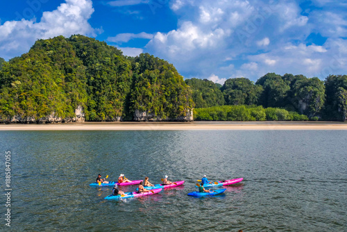 Wallpaper Mural Kayaking adventure on calm water by the tropical islands. A group of people enjoying a scenic kayaking tour on the crystal clear water. Torontodigital.ca