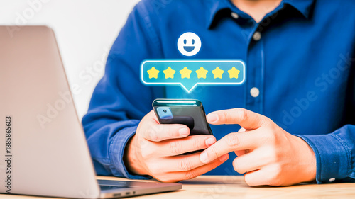 Man with blue shirt using smartphone to give a positive review with happy face and six stars feedback