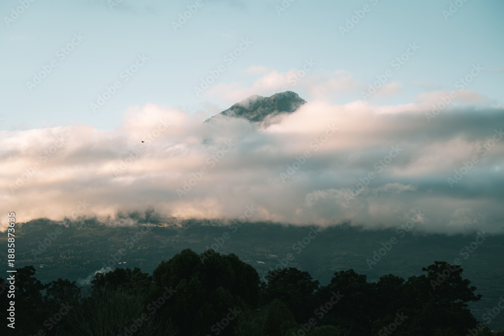 Fototapeta premium Cloud Wrapped Mountain at Sunrise