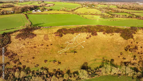 Aerial view of the Folkestone White Horse, a striking chalk figure carved into the hillside, contrasting with the verdant fields, Folkestone, England, United Kingdom.