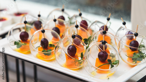 Foto Decorated catering table buffet, banquet with variety of different gourmet exqui