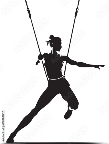 Silhouette of woman swinging on ropes in dynamic pose with athletic wear and hair bun