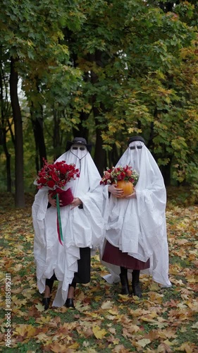 Wallpaper Mural Two people dressed as ghosts holding flower arrangements. Concept of fictional ghost character. Torontodigital.ca