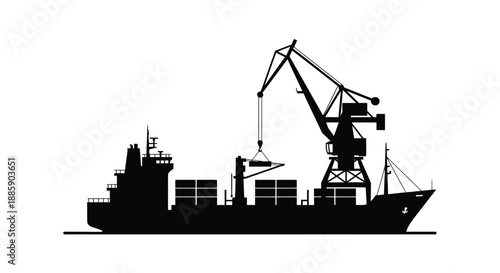 Silhouette of a cargo ship being loaded by a large dockside gantry crane