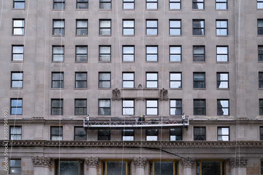 Fototapeta premium Building facade with window washing scaffold