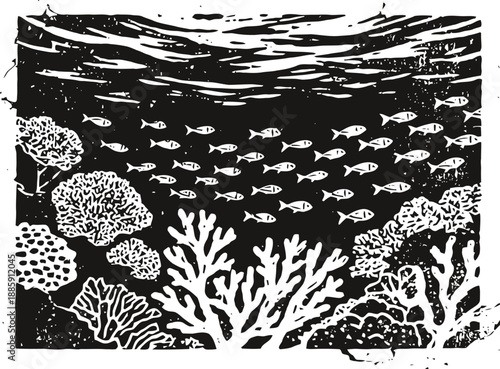 Underwater coral reef with school of small fish swimming in the ocean