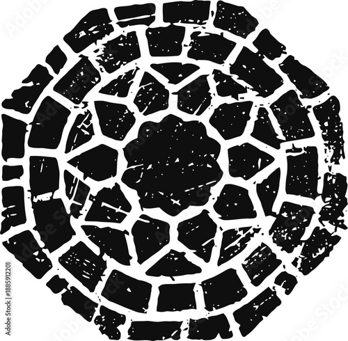 Worn circular stone mosaic pattern with rough texture and irregular shapes