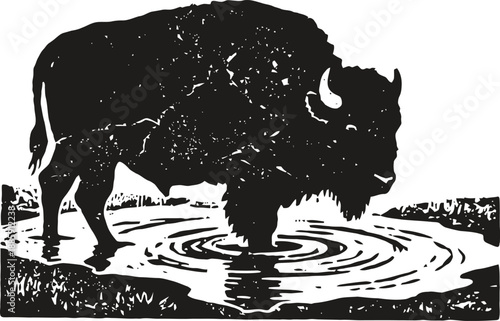 Black silhouette of a bison drinking water from a pond with ripples on the surface
