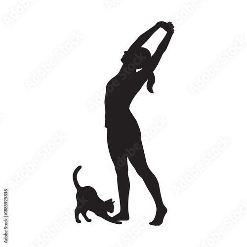 Silhouette of woman stretching with pet cat

