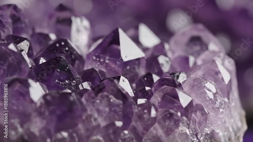 Closeup of a beautiful amethyst crystal cluster with sparkling facets and vibrant purple hues.
