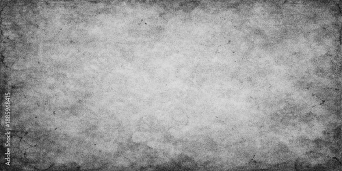 Aged dark grey grunge paper texture background featuring a rough vintage pattern with a dirty stone and concrete surface design for a weathered blank wallpaper