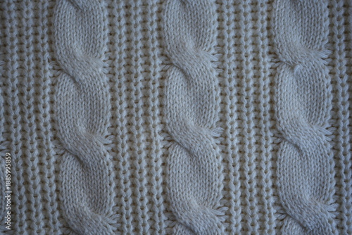 White cable knit texture background
Cream knitted fabric texture macro
Cable knit pattern close-up
White knitted sweater texture