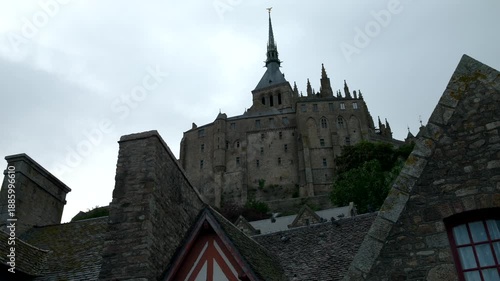 Mont-Saint-Michel, Normandy, 08-24-2024. Low view, Abbey Mont Saint Michel Abbey. Tilt 4K