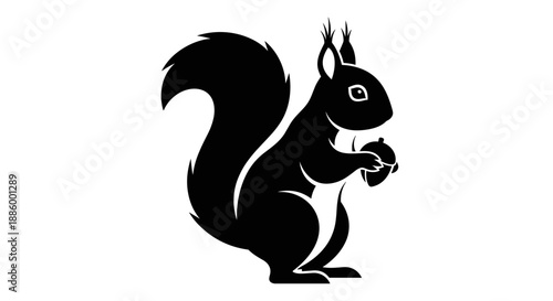 Black Silhouette of a Squirrel Holding an Acorn.